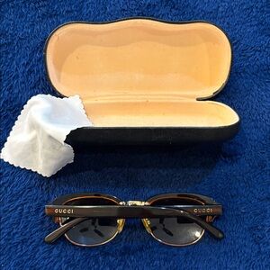 GUCCI Black and Gold Sunglasses with Case and wipe.